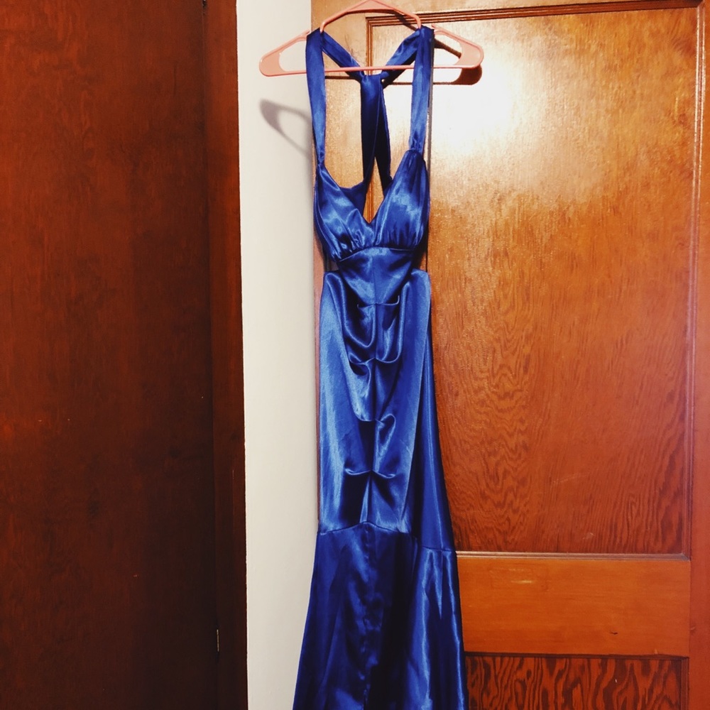 Floor length blue prom dress.